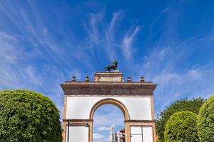 Leon landmark tourist attraction, monument Triumphal Arch of the City of Leon near historic city center photo