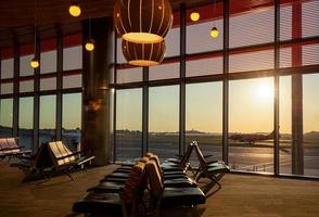 Boston Airport at sunset with planes getting ready for takeoff photo