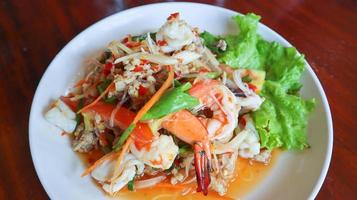 Thai spicy vermicelli salad with seafood and minced pork, Yum Woon Sen. photo