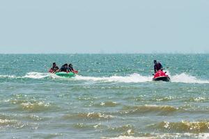 Chonburi, Thailand -06 Mar. 2021 The atmosphere of people playing water activities at Bangsaen beach. photo