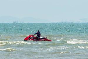 Chonburi, Thailand -06 Mar. 2021 The atmosphere of people playing water activities at Bangsaen beach. photo