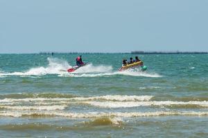 Chonburi, Thailand -06 Mar. 2021 The atmosphere of people playing water activities at Bangsaen beach. photo