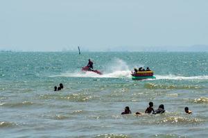 Chonburi, Thailand -06 Mar. 2021 The atmosphere of people playing water activities at Bangsaen beach. photo