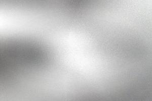 Glowing silver foil paper wall with copy space, abstract texture background photo