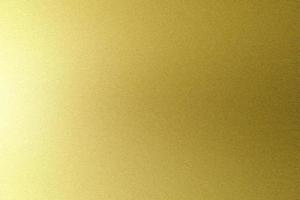 Brushed gold metallic wall with scratched surface, abstract texture background photo