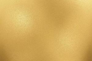 Texture of rough gold metallic sheet, abstract background photo