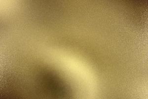 Glowing gold wave metal plate, abstract texture background photo