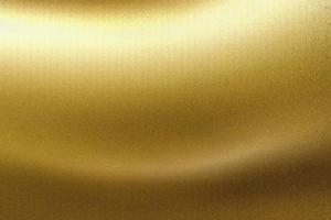 Light shining on gold wave metallic board, abstract texture background photo