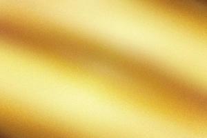 Light shining on gold painted metallic wall with copy space, abstract texture background photo