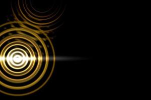 Abstract light circle effect with gold rings on black background photo