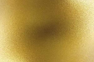 fondo de textura abstracta, placa de metal dorado pulido brillante foto