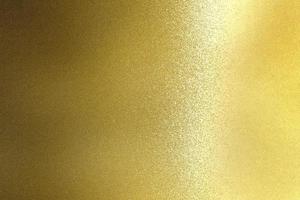 Shiny rough gold steel panel, abstract texture background photo