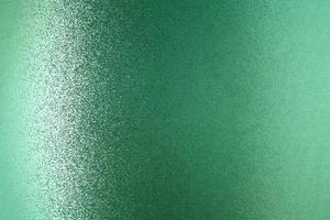 Glowing green metallic wall, abstract texture background photo