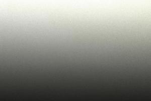 Light shining on rough black paint steel wall texture, abstract background photo