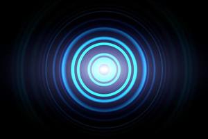 Abstract glowing circle blue light effect with sound waves oscillating background photo