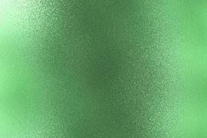 Texture of rough dark green paint metal wall, abstract background photo