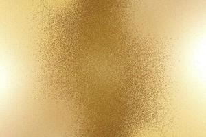 Light shining on rough bronze metal wall texture, abstract background photo