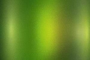 Glowing brushed light green metallic wall surface, abstract texture background photo