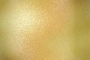 Texture of yellow brushed metallic plate, abstract background photo