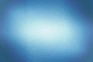 Light shining on dark blue scratch metal wall with copy space, abstract texture background photo