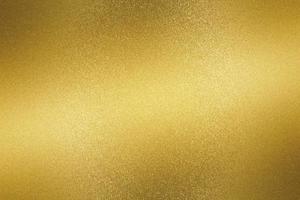 Glowing gold metallic plate surface, abstract background photo