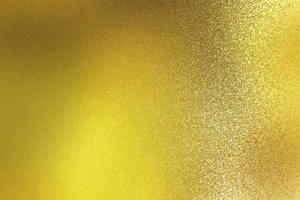 Abstract texture background, shiny on rough gold steel wall photo