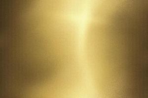 Light shining on gold wave metal wall, abstract texture background photo