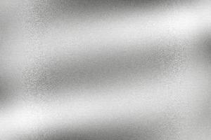 Light shining on silver metal sheet, abstract texture background photo