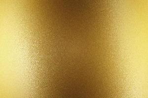 Light shining on gold steel wall, abstract texture background photo