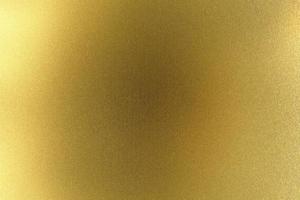 Brushed golden metal wall, abstract texture background photo