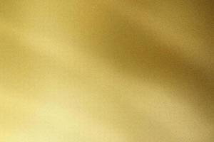 Brushed golden wave metallic wall, abstract texture background photo