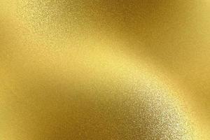 reflejo del metal dorado ondulado, fondo de textura foto
