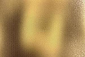 Brushed gold metallic wall with scratched surface, abstract texture background photo