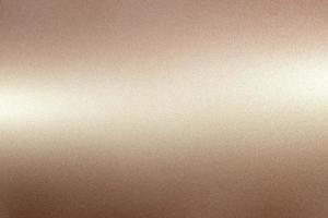 Brushed brown metallic wall with scratched surface, abstract texture background photo