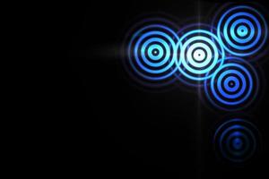 Abstract light ring effect with blue sound waves oscillating on black background photo