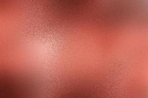 Texture of rough dark red paint metal wall, abstract background photo