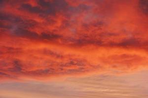 Orange sky, Colorful cloudy sky at sunset. Gradient color. Sky texture, abstract nature background photo
