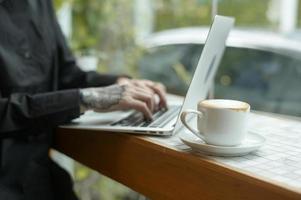 Portrait of senior businesswoman in coffee shop photo