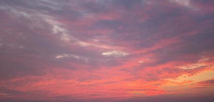 Purple-pink sunset in the sky, clouds. Summer time. Background, copyspace photo