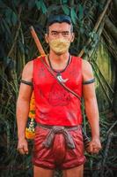 Samut Songkhram-Thailand - 23 October 2021 Statue of an ancient warrior of Thailand wearing a mask. photo