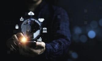 Business man using mobile phone for communication working and transaction ,Global  business by internet connection technology for financial banking , big data and digital linkage concept. photo