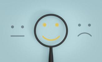 Yellow smile face inside of magnifier glass between sad and normal emotion for focus positive emotion concept. photo