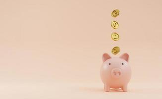 2022 year on golden coin falling to pink piggy saving bank on pink background and copy space for new year banking saving concept by 3d render. photo