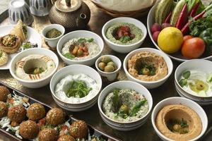 mixed middle eastern meze sharing food platter in turkish restaurant photo