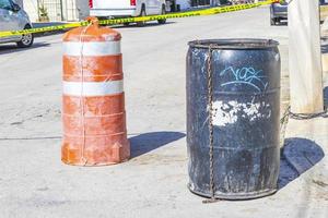 Black trash garbage cans dirty street Playa del Carmen Mexico. photo