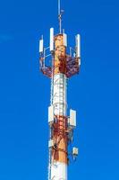 Red white 5G tower radiation in Playa del Carmen Mexico. photo
