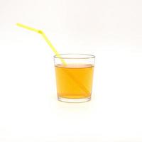 a glass of apple juice with a straw isolated on a white background photo