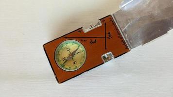 A special compass to determine the Qibla direction of the grave. photo