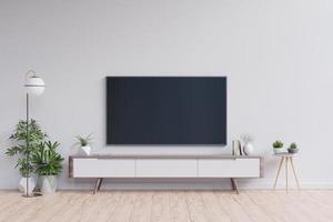 TV on the cabinet in modern living room on white wall background. photo