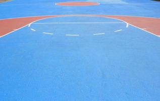 The basketball court with white lines. photo